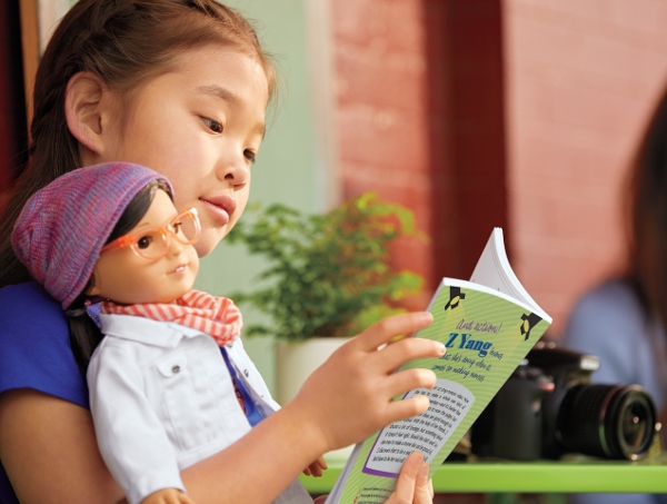 A young girl reads Z's backstory, finding comfort in having her appearance reflected within.