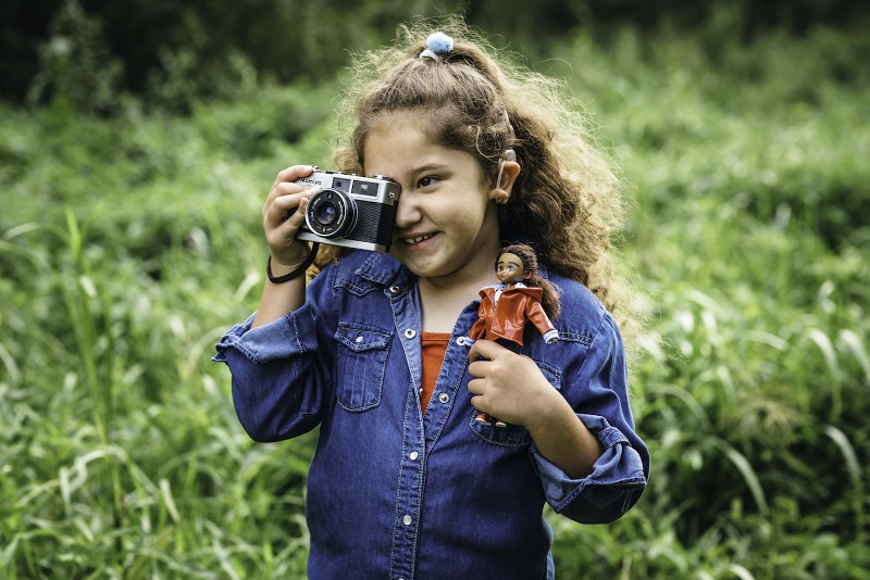 The Wildlife Photographer at play, both as doll and as child shutterbug