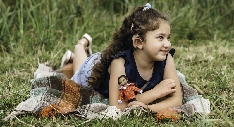 A girl with a cochlear implant has a doll that reflects her reality, from Lottie Dolls.