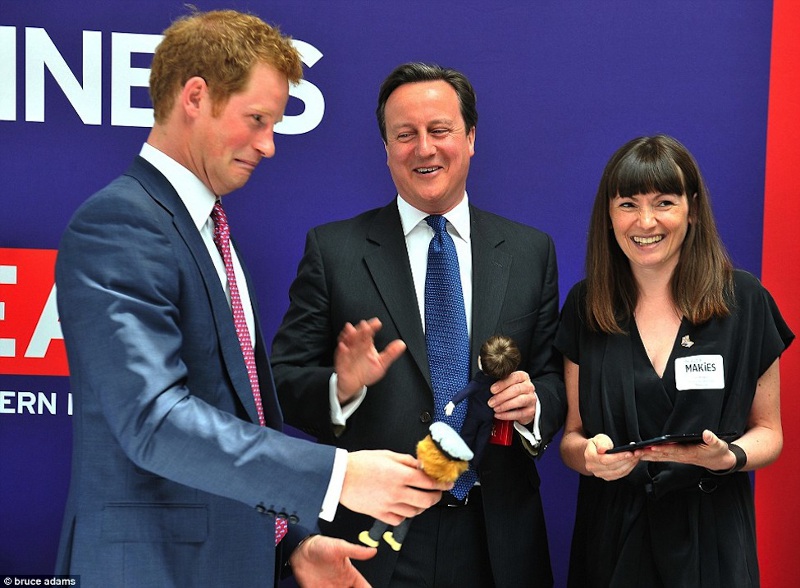 Harry meets his MAKIES doll and makes a face, Courtesy of Daily Mail/Bruce Adams