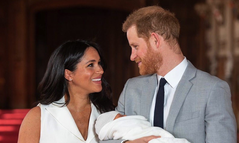 Harry holds the baby